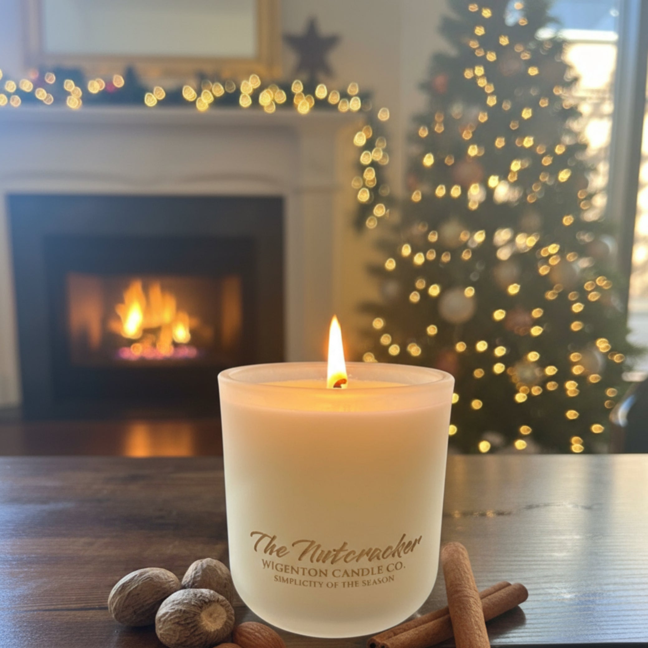 The Nutcracker wooden wick soy candle from Wigenton Candle Co. glowing on a wooden table with cinnamon and nutmeg beside it in a cozy holiday living room