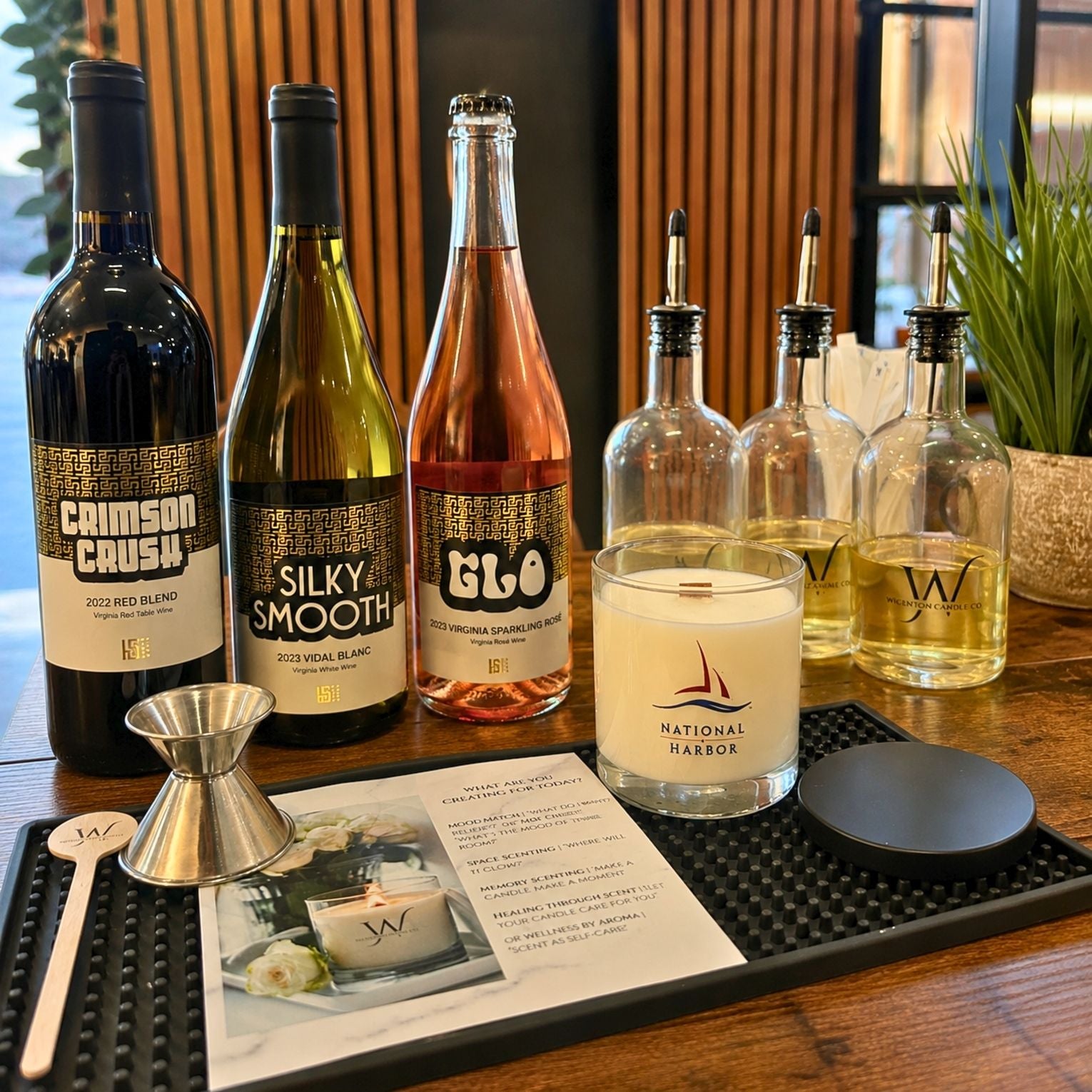National Harbor candle and wine experience featuring Hedon State Wines, fragrance blending oils, and luxury candle-making ambiance at Wigenton Candle Co.