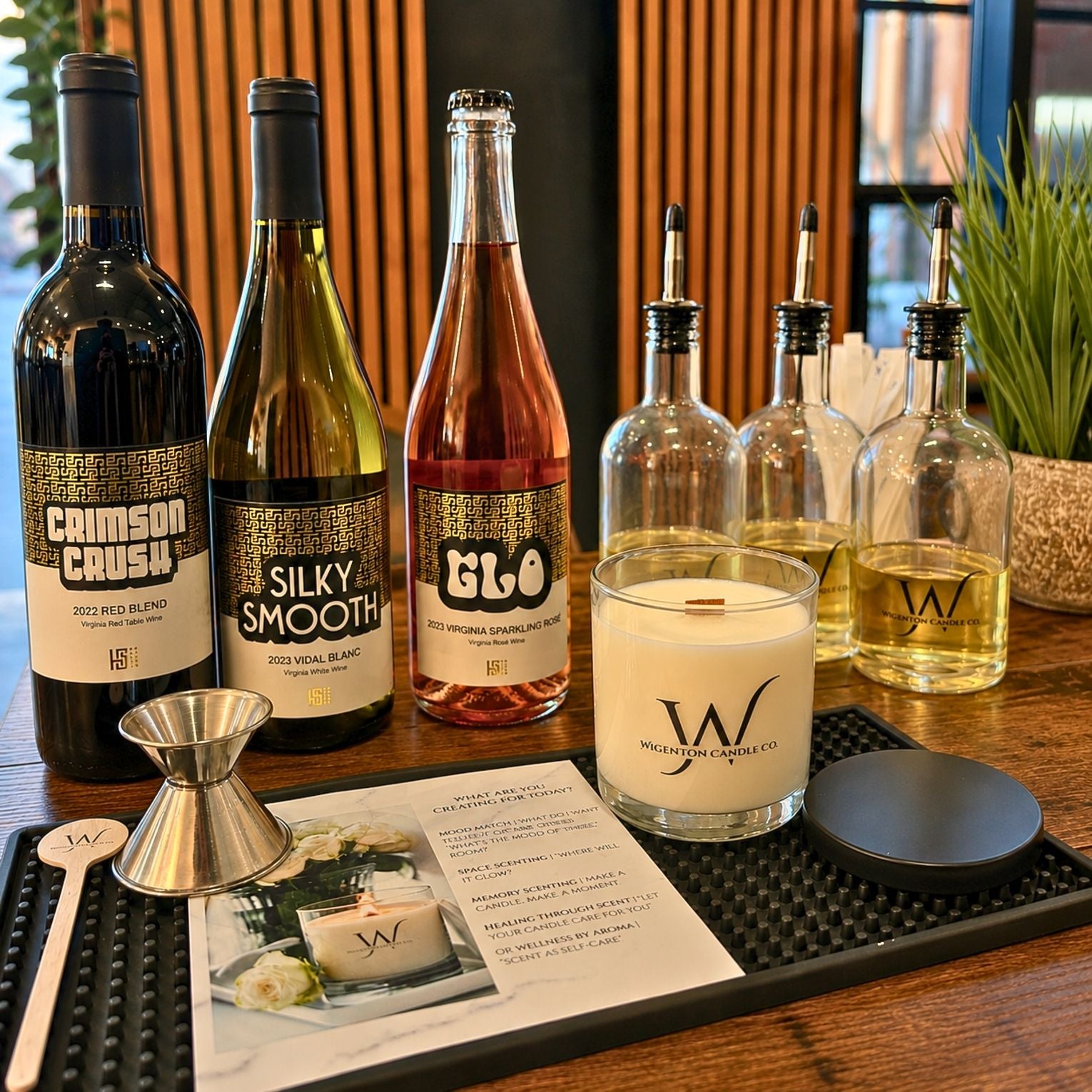 Luxury wine and fragrance experience at Wigenton Candle Co. featuring Hedon State Wines, custom candle pouring, fragrance oils, and warm ambient lighting.