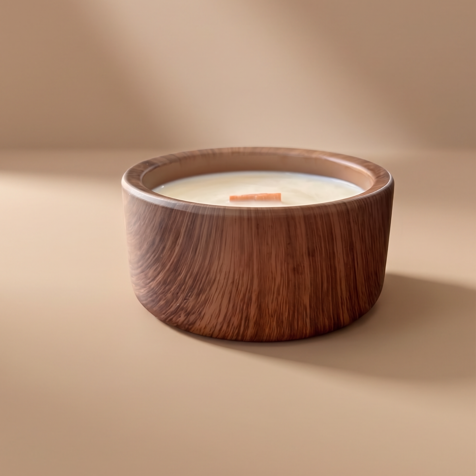 Ceramic candle holder with soy candle inside, and wooden wick on a beige background.