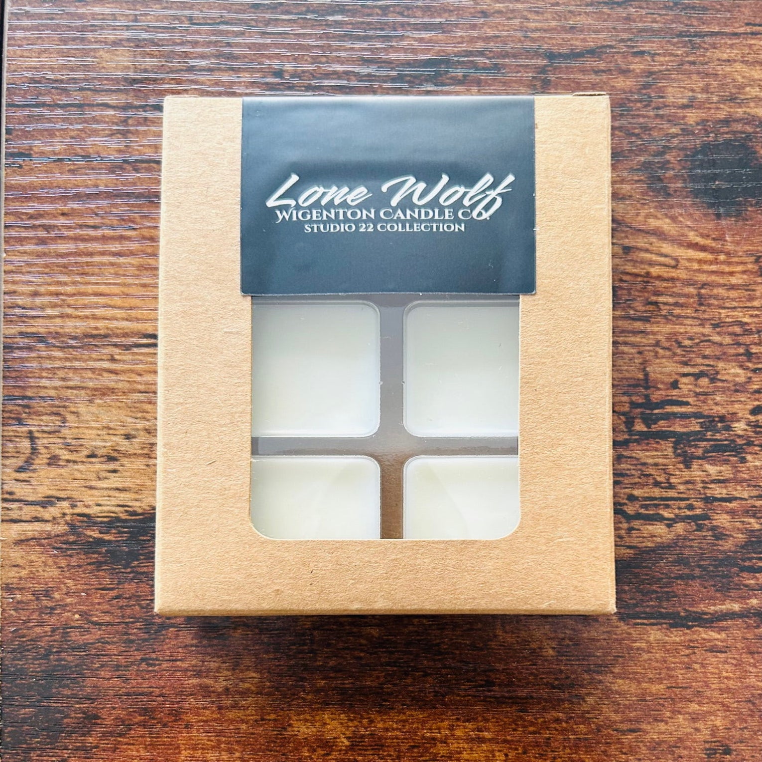 Box of Lone Wolf wax melts by Wigenton Candle Co. on a wooden surface