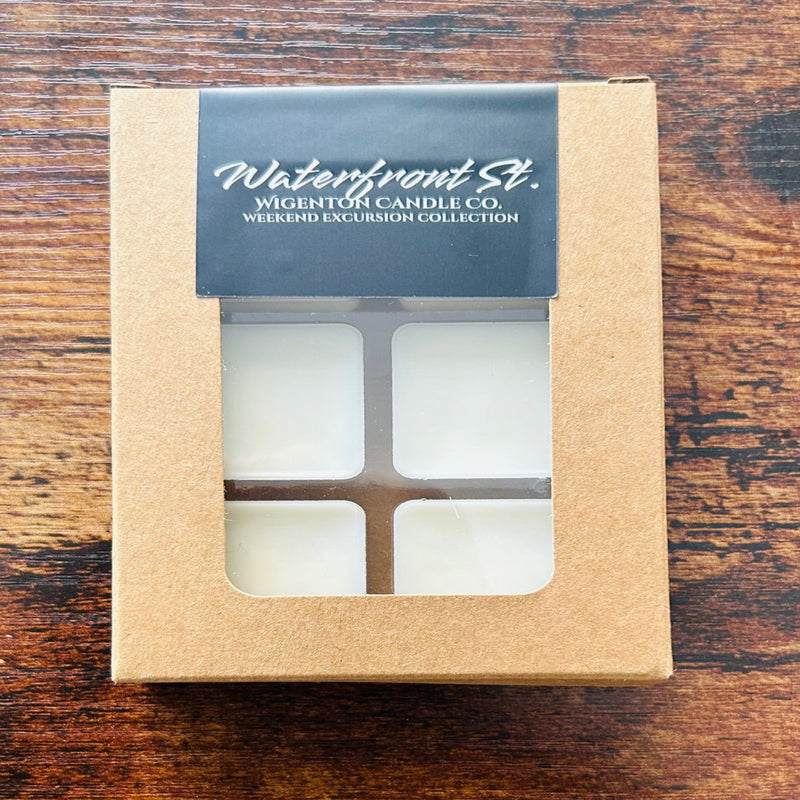 Box of melts with 'Waterfront St.' branding on a wooden surface