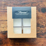 Box of Wigenton Candle Co. wax melts on a wooden surface