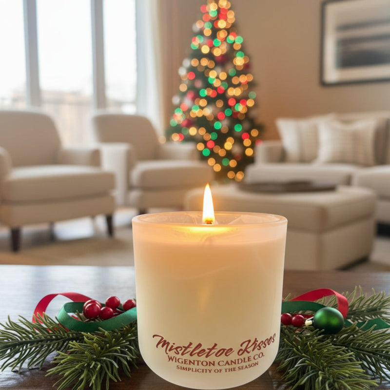 Mistletoe Kisses wooden wick soy candle from Wigenton Candle Co. surrounded by pine and ribbon, glowing in a cozy holiday living room