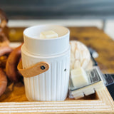 This Electric Wax warmer with leather handle quickly melts our artisan soy wax melts it also has a relaxing glow with installed bulb.